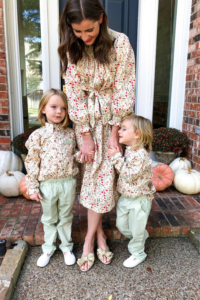 mom with young boys in matching outfits for thanksgiving