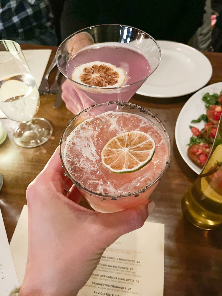 toasting with pink cocktails