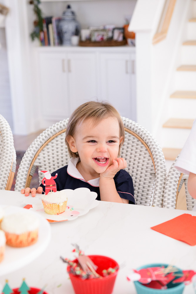 baby boy laughing sitting in chair