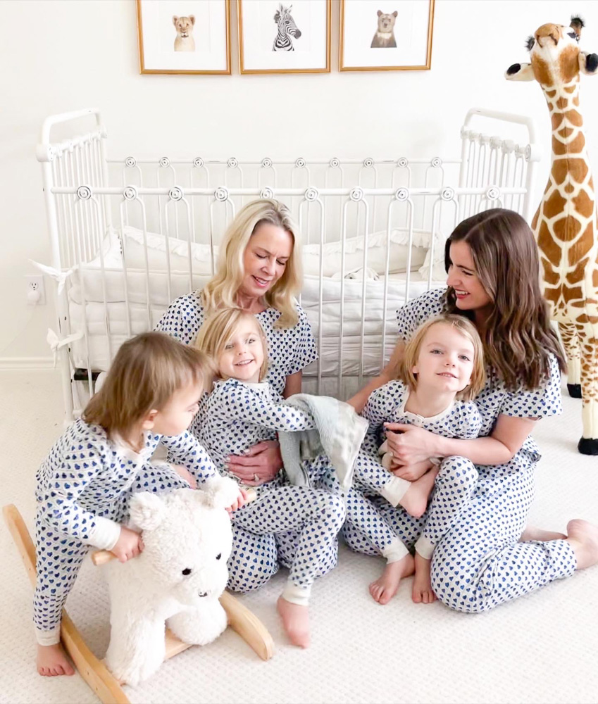 mom and grandmother with three preschool boys in matching pajamas