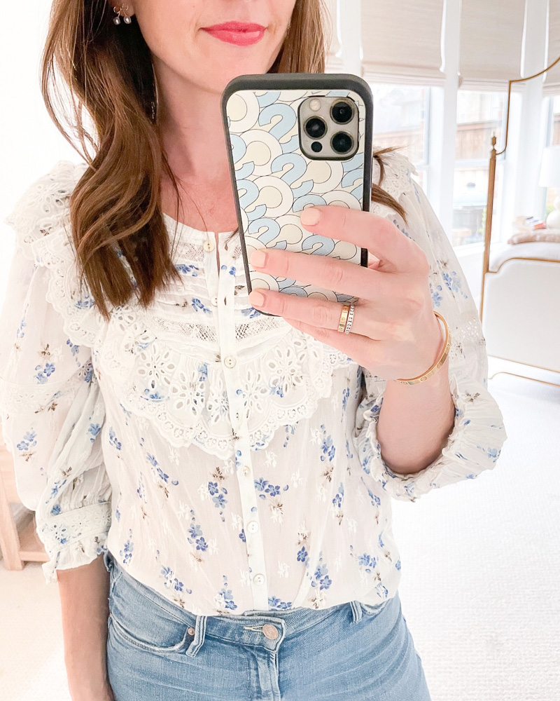 woman in mirror in floral top