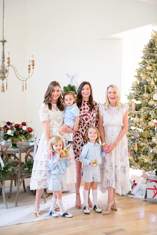 family group with toddler boys in front of cChristmas tree