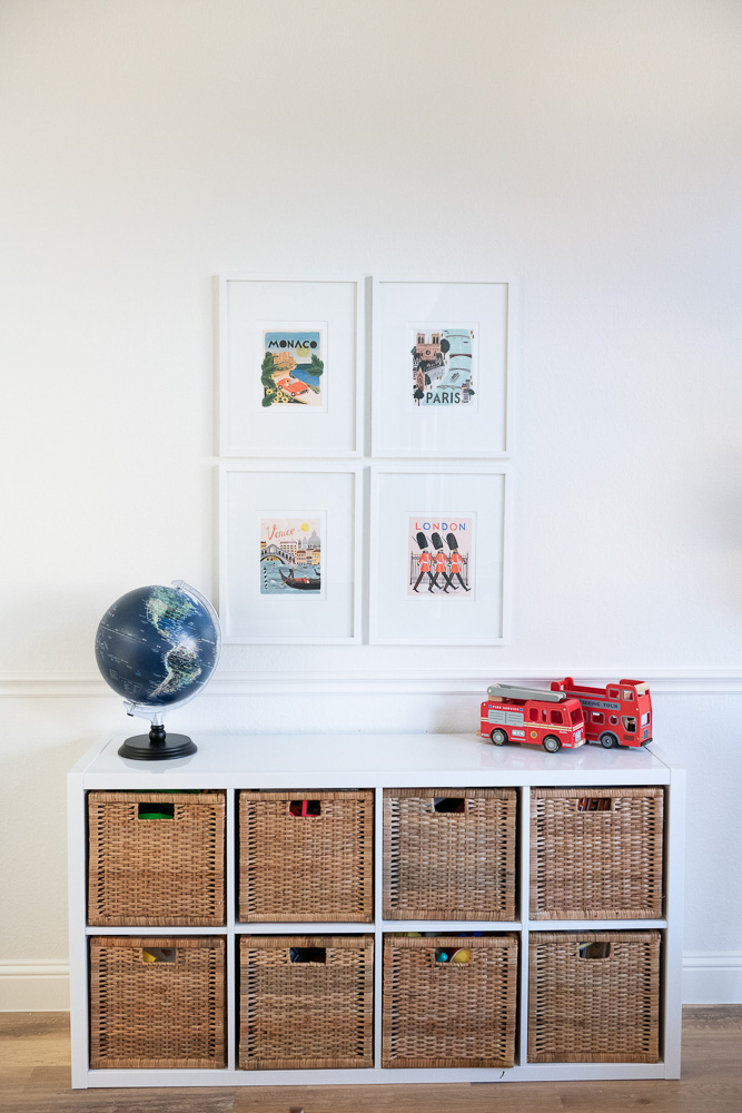 playroom with basket storage and travel prints