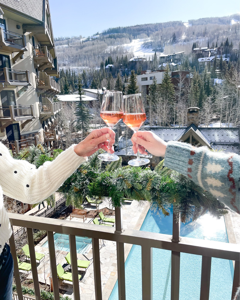toasting with rose champagne snow view