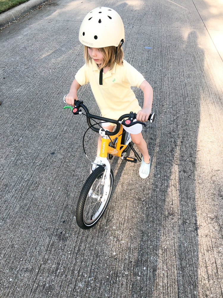 toddler boy learning to ride bike