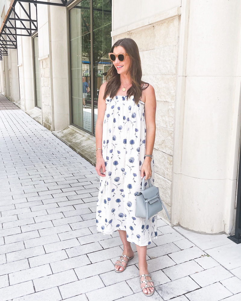 woman wearing blue and white floral print midi dress