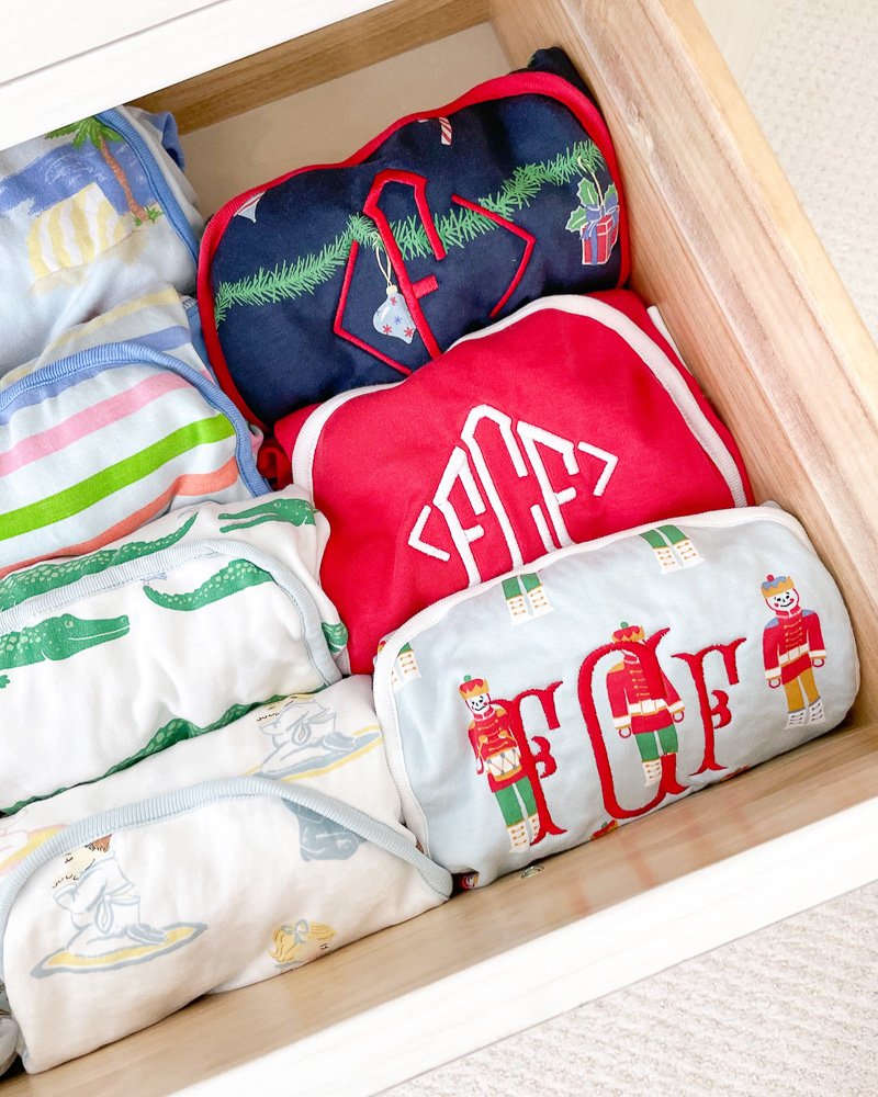 assortment of toddler boy pajamas in a drawer