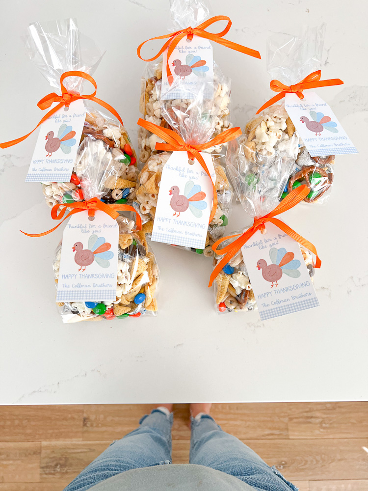 treat bags filled with blessing mix tied with orange ribbon