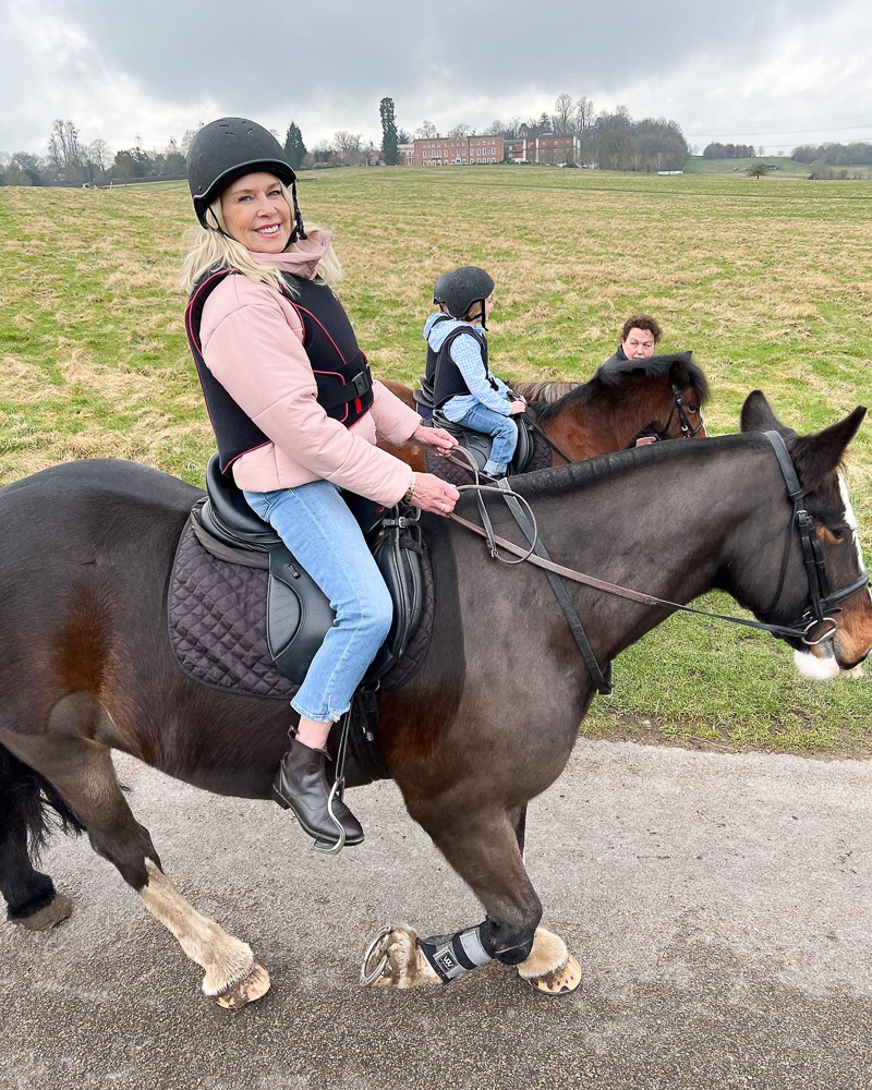 woman riding a horse english countryside