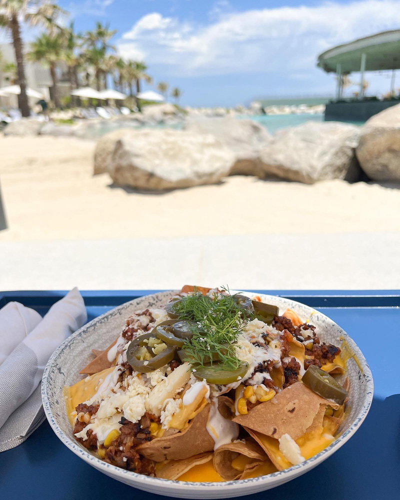 plate of nachos on the beach