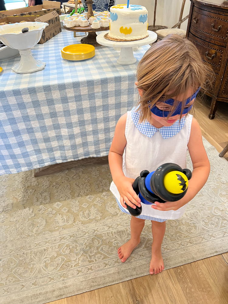 toddler boy wearing batman mask