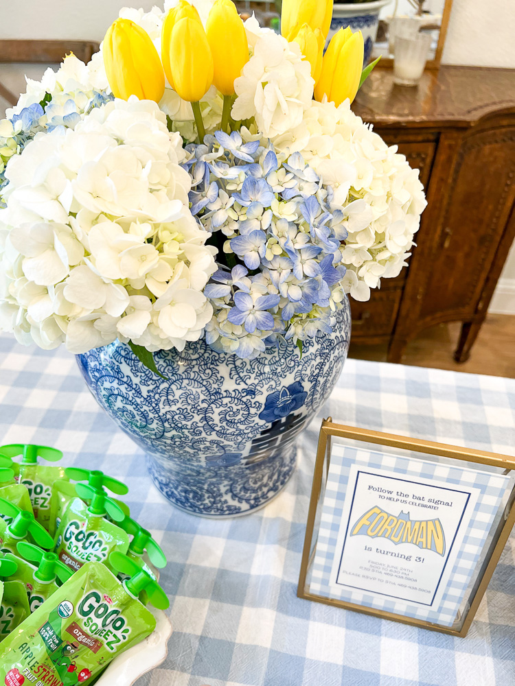 flowers and invitation on dining table