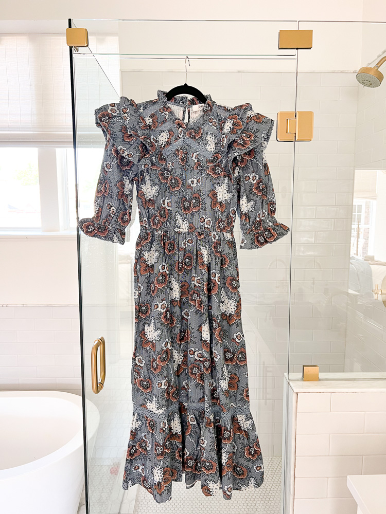 fall floral midi dress hanging on shower door