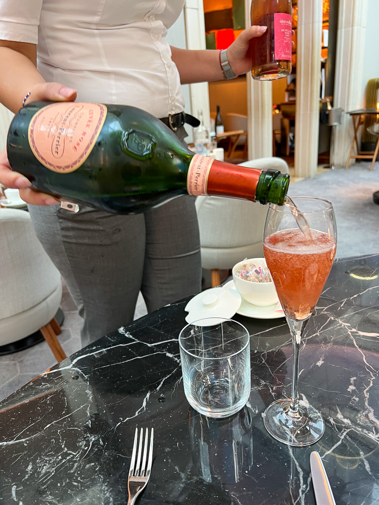 pouring champagne tea at the connaught london