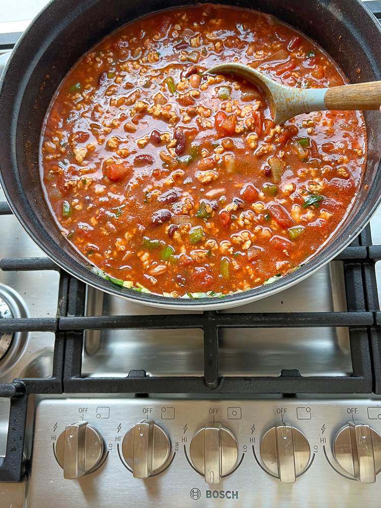 pot of chili simmering on stove
