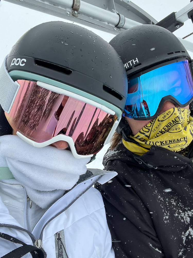 two toddler boys in ski masks and helmets