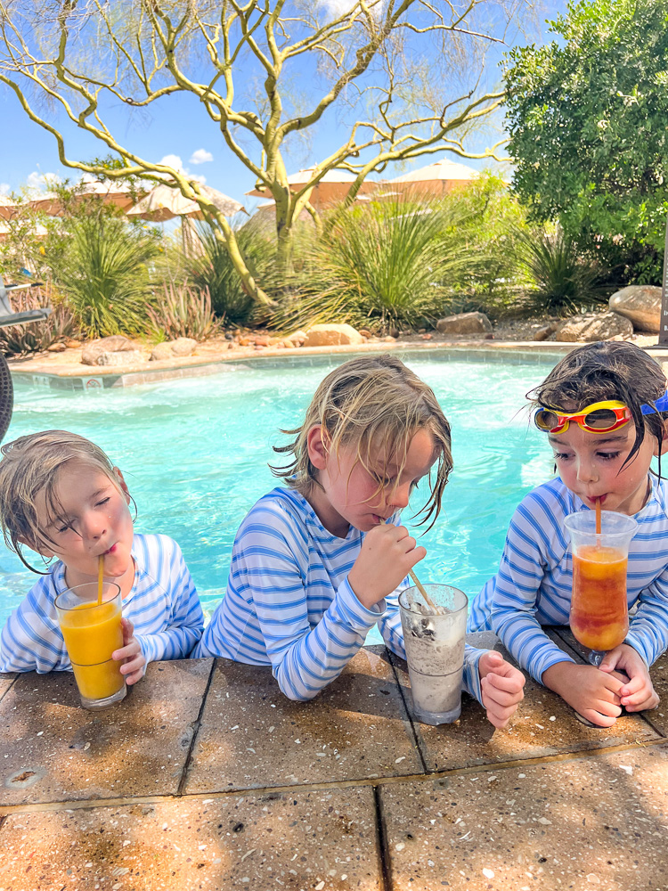 three little boys having smoothies at pool four seasons scottsdale