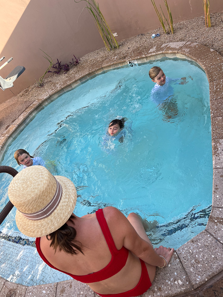 mom and three little boys in suite plunge pool four seasons scottsdale