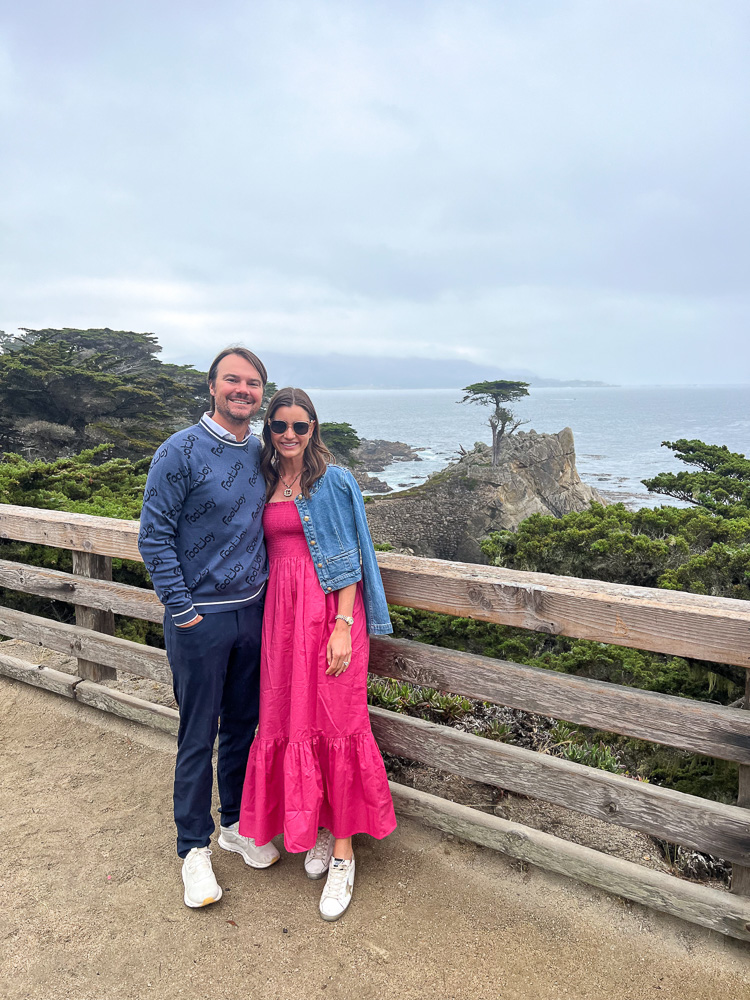 a couple standing with a Pebble Beach