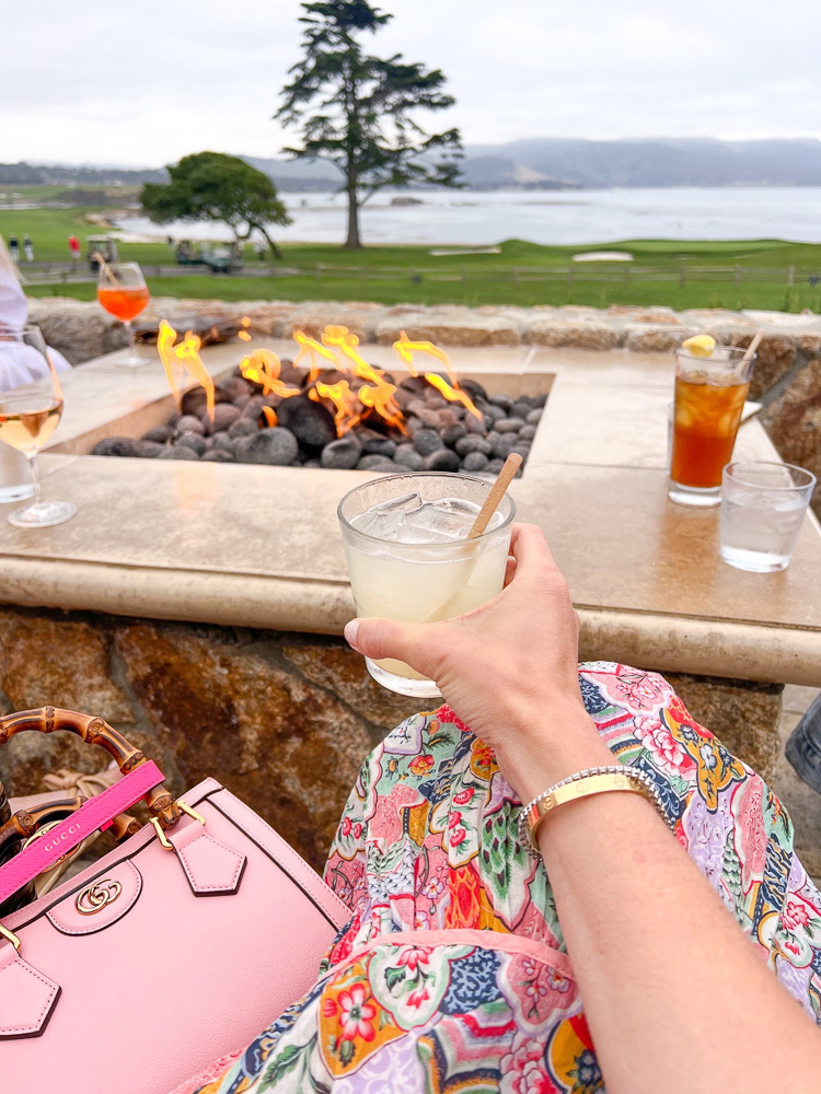 sitting by the fire with a cocktail at spanish bay