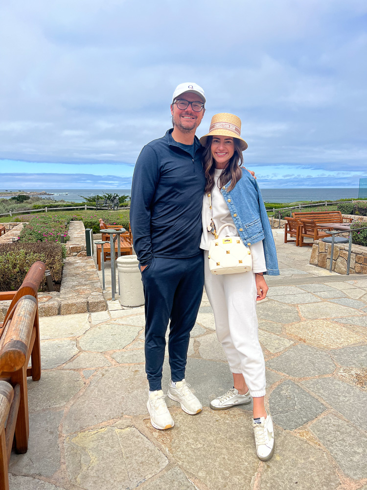 couple standing on the patio at pebble beach