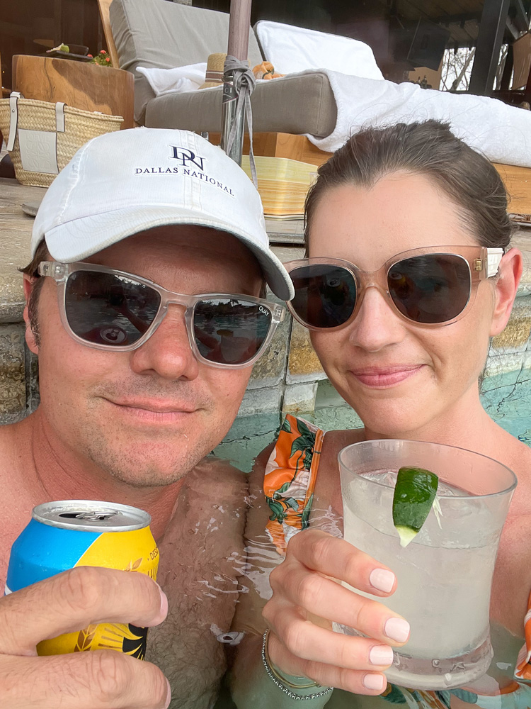 couple having cocktails in the pool