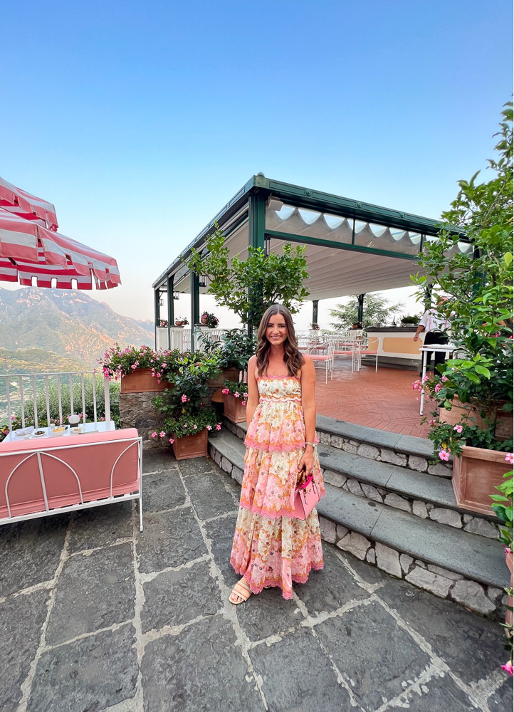 woman dressed in floral maxi dress on the patio palazzo avino