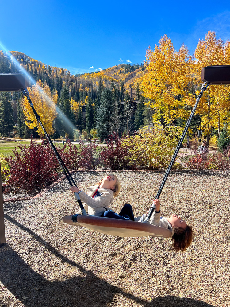 two boys on tire swing ford park vail