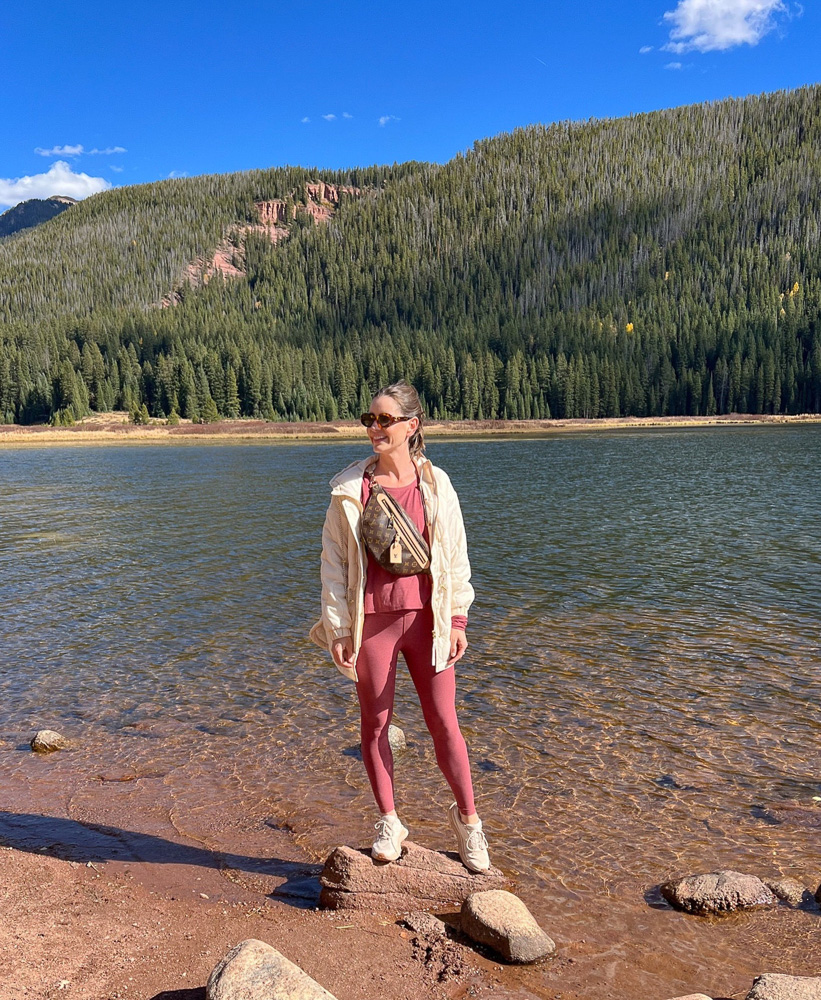 woman standing on a rock in river vail