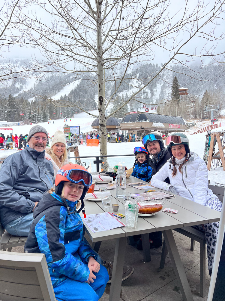 family gathered outside slope side for lunch